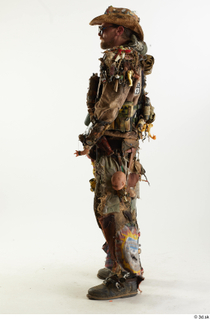 Ryan Miles in Junk Town Postapocalyptic Bobby Suit holding gun…